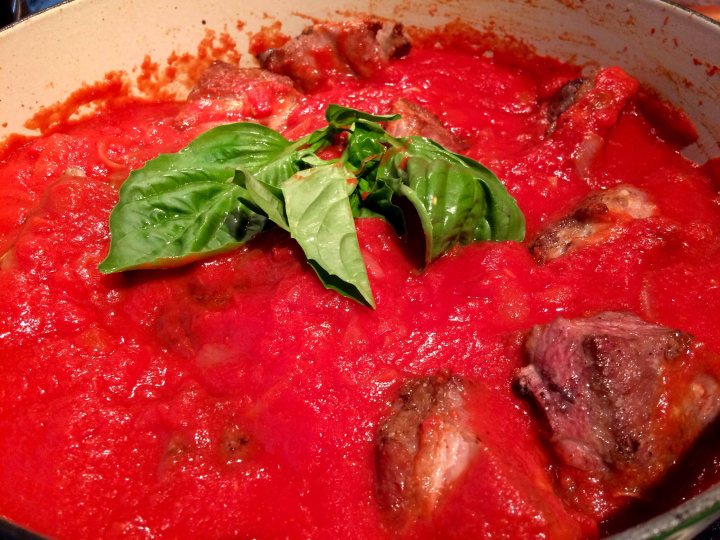 With the tomatoes amd basil